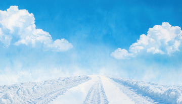 雪路延伸于蓝天白云之下