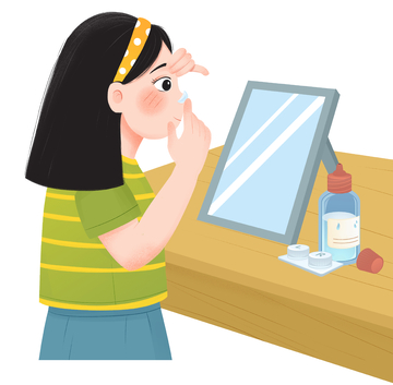 女孩对着镜子戴隐形眼镜