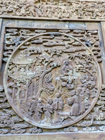 古典圆形浮雕佛教故事木雕装饰