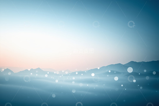 蓝色渐变远山带光斑背景画面