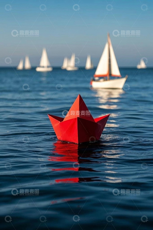 海上红色纸船与帆船景象