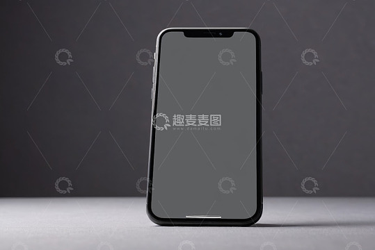 黑色智能手机放在灰色背景上