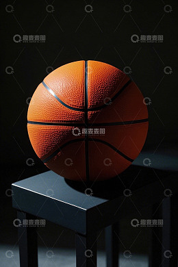置于黑色台子上的橙色篮球