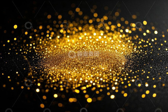 黑色背景上的金色发光粒子