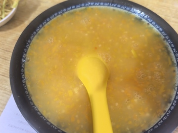 南瓜粥汤勺美食图