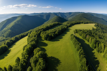航拍山间森林与草地风景