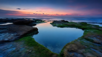 海岸晚霞静水美景