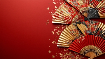 红色背景上的金色和红色折扇