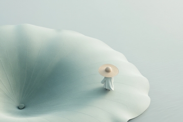 小人撑伞立于巨大荷叶之上