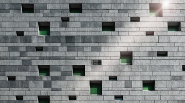 灰色砖墙上的绿色窗户