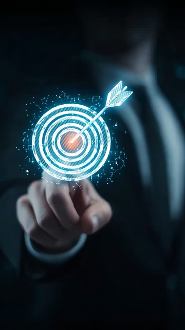 商务人士指尖触碰发光箭靶象征目标达成