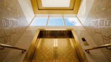 现代建筑内部金色电梯门与几何墙面设计