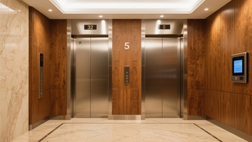 现代建筑电梯厅木质墙面与不锈钢电梯门
