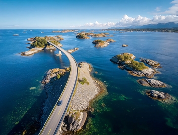 蜿蜒公路穿越海岛连接碧海蓝天的壮丽航拍景观