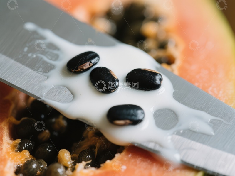 高清大图下载【趣麦麦图】切开的木瓜与刀上的白色汁液