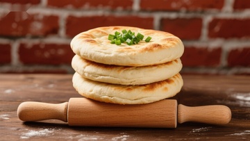 葱花饼叠放于擀面杖上