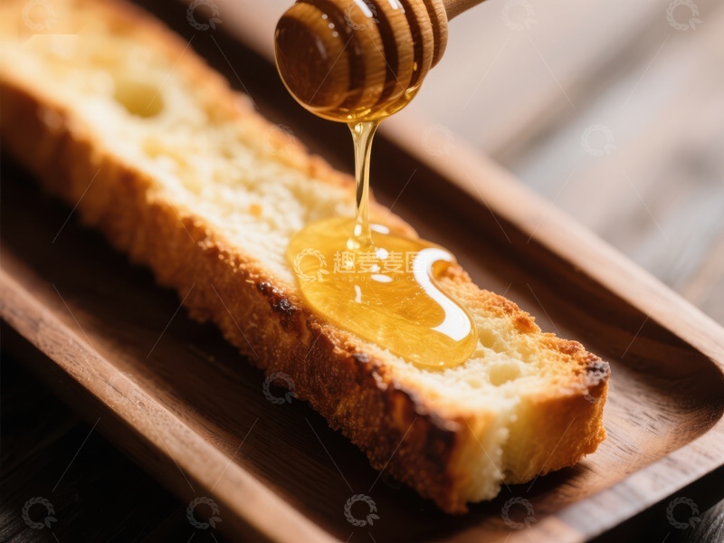 高清大图下载【趣麦麦图】蜂蜜缓缓滴落于面包之上