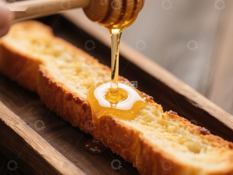高清大图下载【趣麦麦图】蜂蜜缓缓滴落于烤面包上
