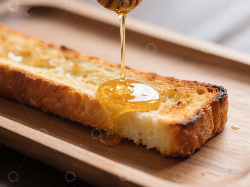高清大图下载【趣麦麦图】蜂蜜缓缓滴落于烤面包上